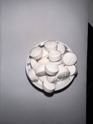 Oxycodone Hydrochloride Oxycodone, sold under various brand names such as Roxicodone and OxyContin (which is the extended release form), is a semi-synthetic opioid used medically for treatment of moderate to severe pain. It is highly addictive and It is usually taken by mouth, and is available in immediate-release and controlled-release formulations. Onset of pain relief typically begins within fifteen minutes and lasts for up to six hours with the immediate-release formulation. In the United Kingdom, it is available by injection. Combination products are also available with paracetamol (acetaminophen), ibuprofen, naloxone, naltrexone, and aspirin. Medical uses Oxycodone is used for managing moderate to severe acute or chronic pain when other treatments are not sufficient. It may improve quality of life in certain types of pain. Numerous studies have been completed, and the appropriate use of this compound does improve the quality of life of patients with long term chronic pain syndromes.